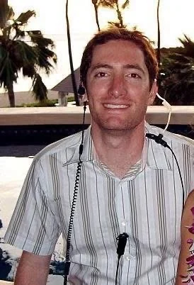 David Price wearing a production headset on the set of High School Reunion in Maui.