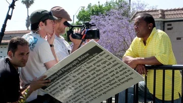 David Price and The Peacemaker production crew preparing an outdoor interview with on-camera talent